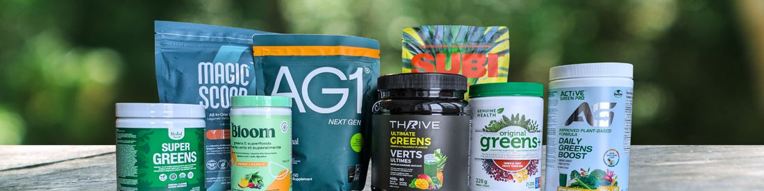 Group photo of popular greens powders in Canada, including AG1, Magic Scoop, Thrive Ultimate Greens, SUBI, Genuine Health, Bloom, Active Green Pro, and Nested Naturals, displayed side by side outdoors.