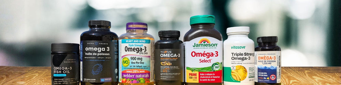 A lineup of omega-3 supplement bottles including Sports Research, Nutra Champs, Webber Naturals, Thrive, Jamieson, Vitasave, and a further omega-3 bottle, displayed on a wooden surface.